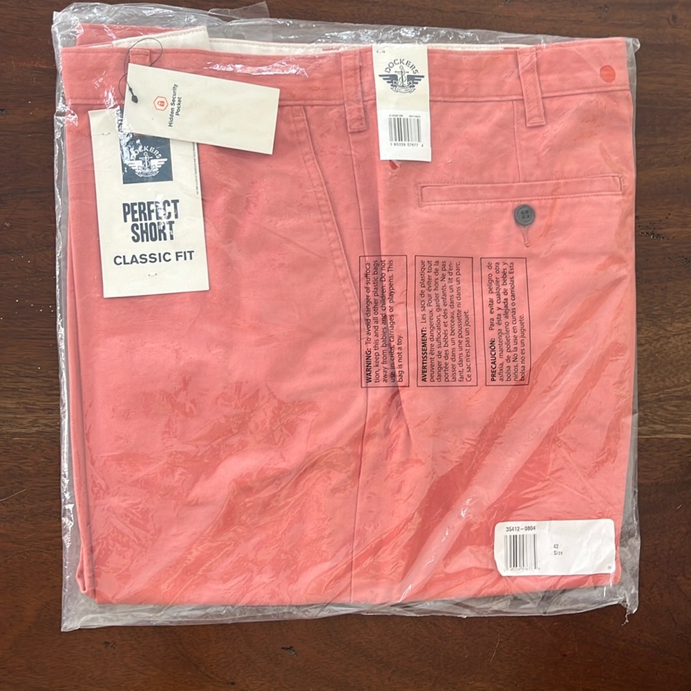 Dockers Men’s Perfect Short. Coral. Size 42 (waist). 10.5 inseam. New with tags.